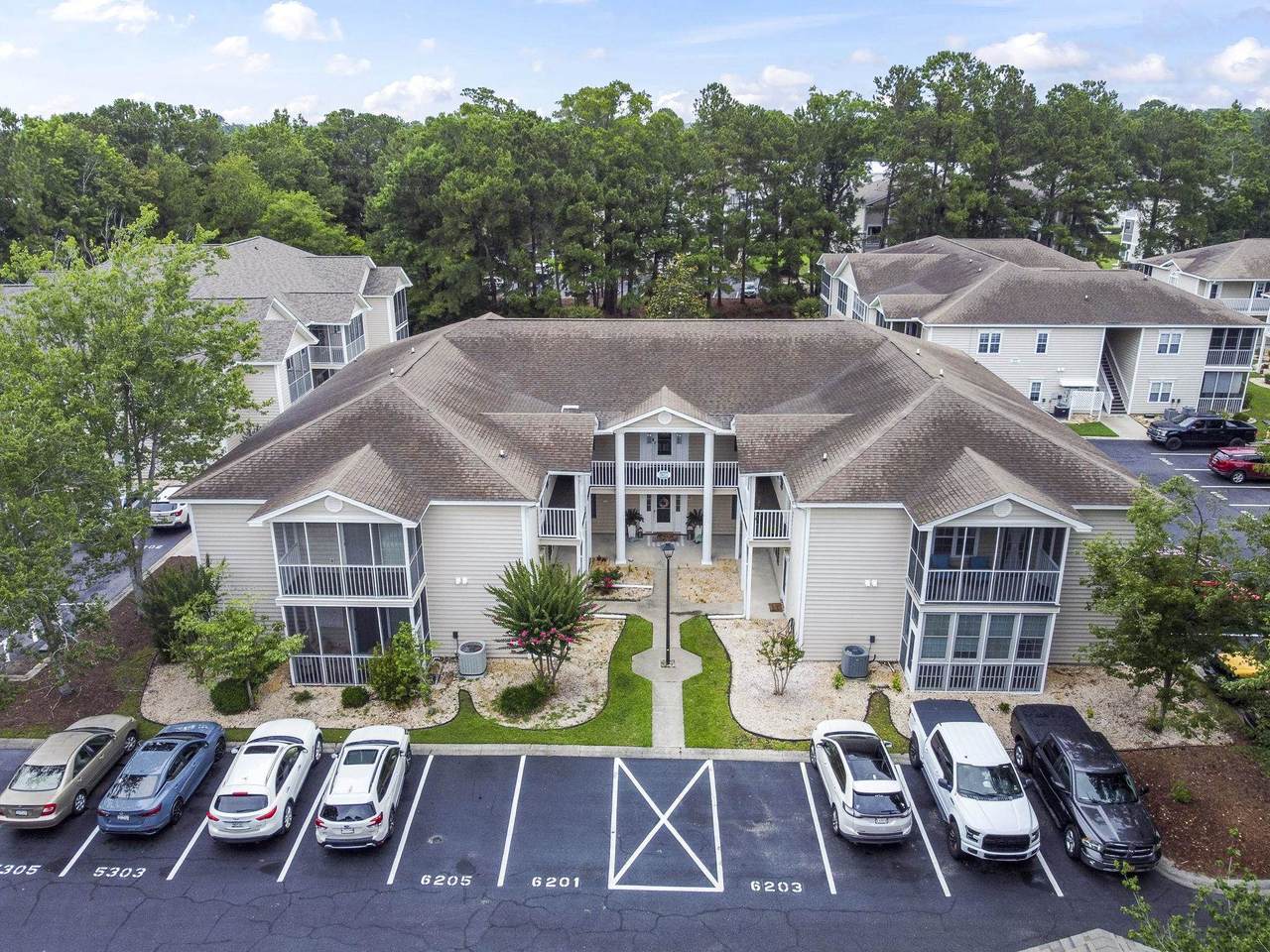Aerial view of the Sweetwater condo building at 6210 Sweetwater Boulevard
