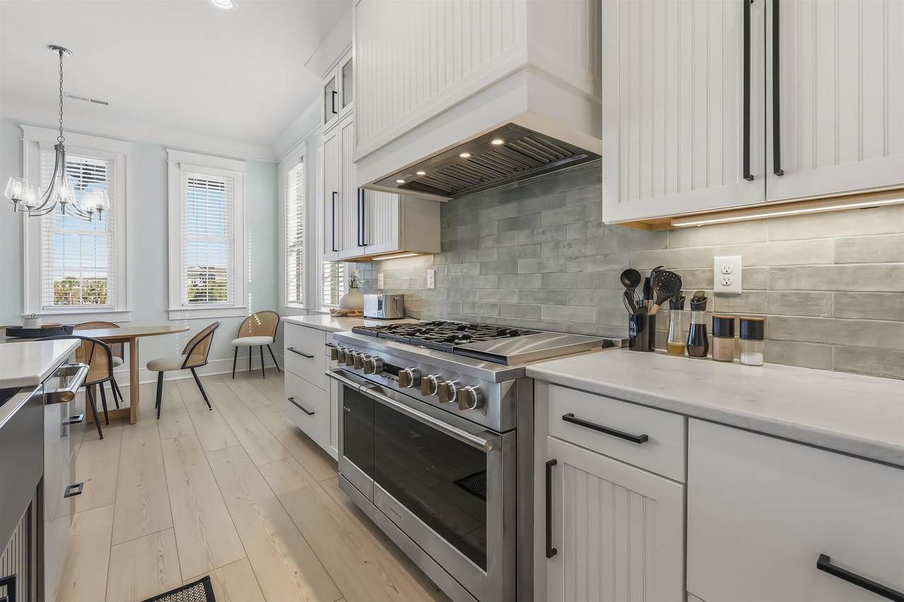Kitchen island, double ovens and open dining area