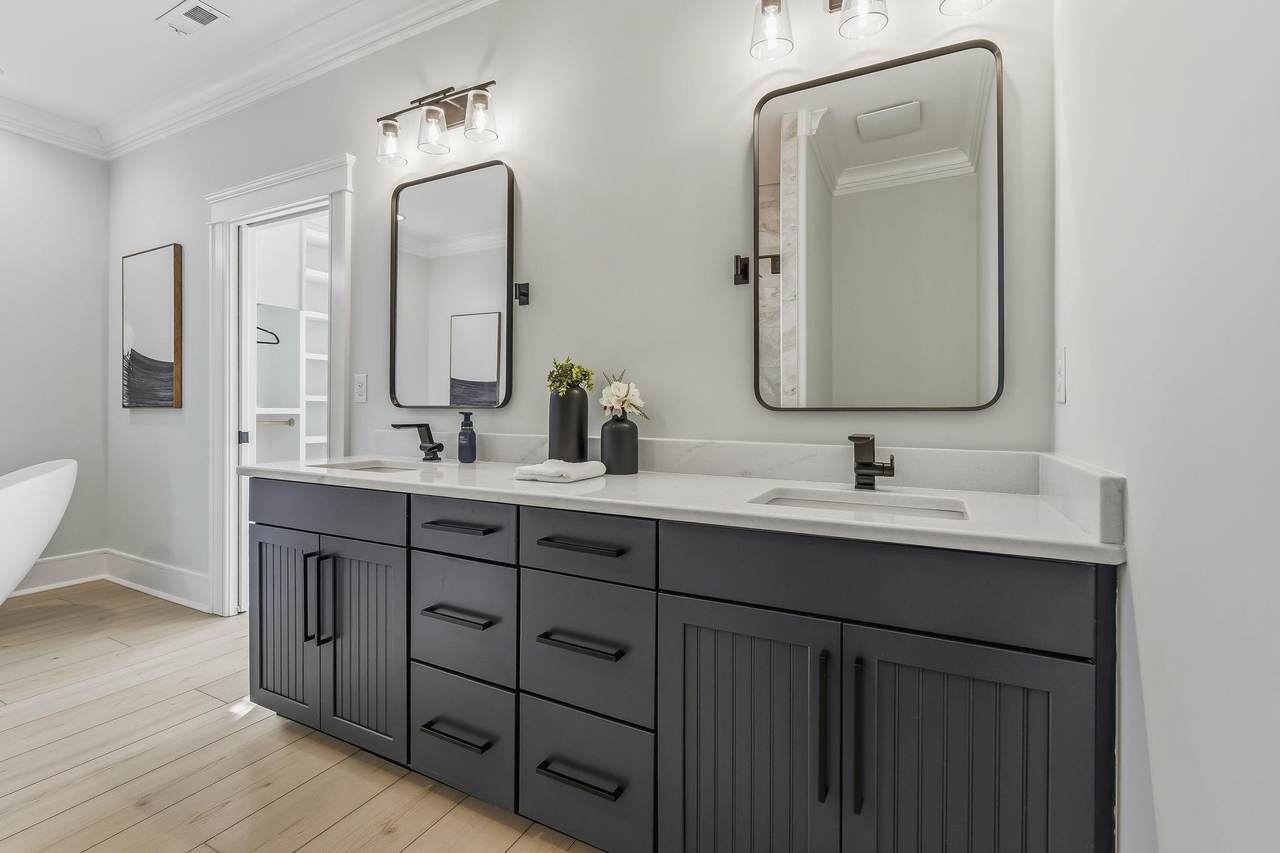 Primary bathroom with dual vanity and freestanding soaking tub