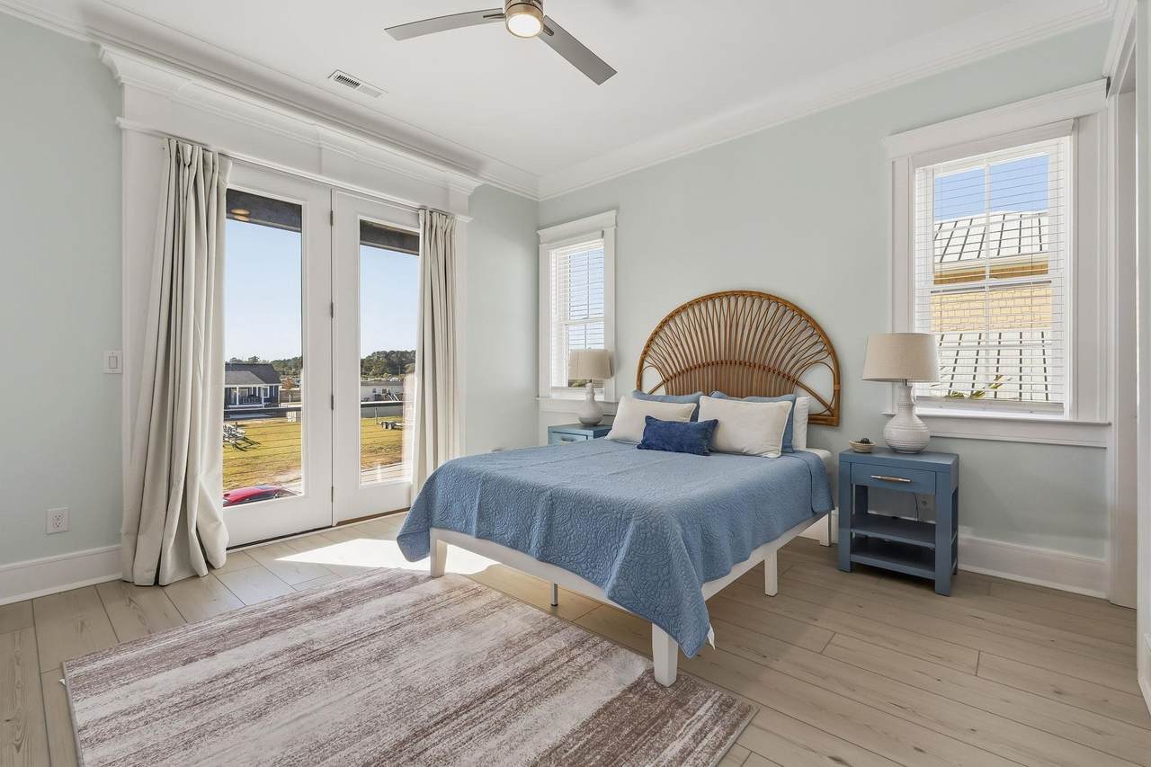 Guest bedroom with windows overlooking the water