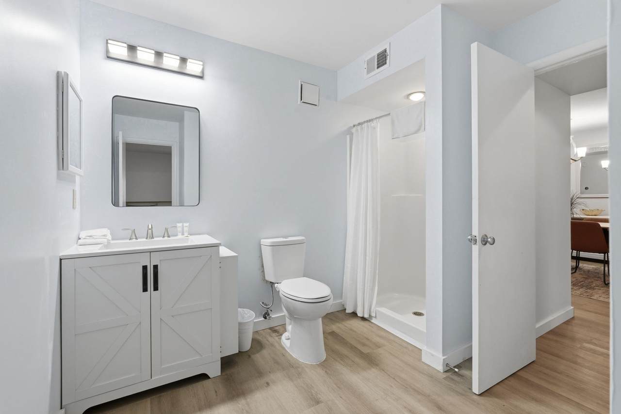 Full bathroom with vanity and tub-shower combination
