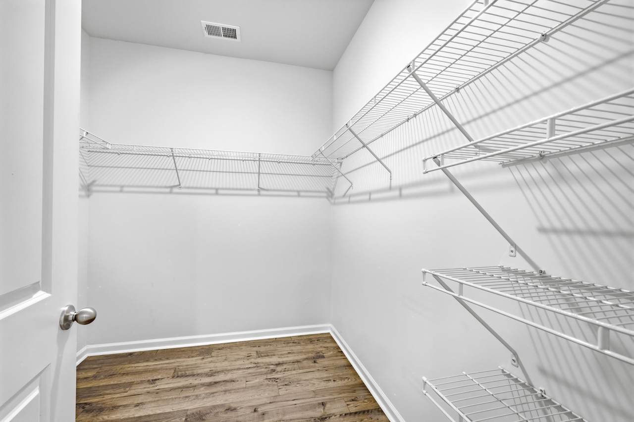 Large walk-in closet with wire shelving