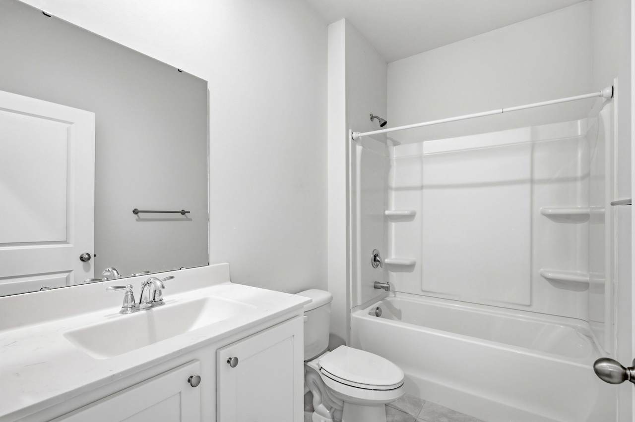 Full hall bathroom with tub-shower combination