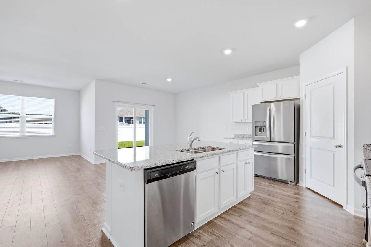 Kitchen and dining area with access to the rear yard