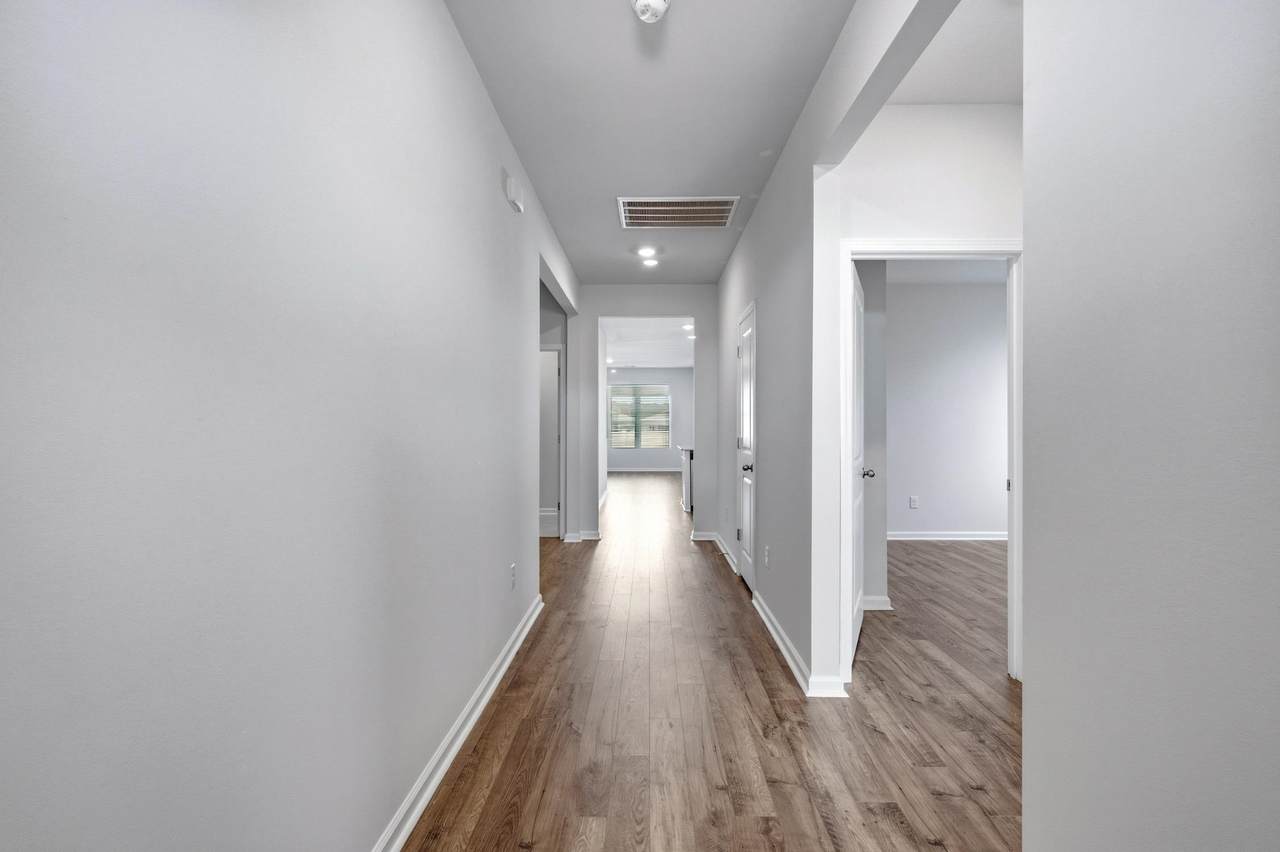 Entry hallway with wood-look flooring