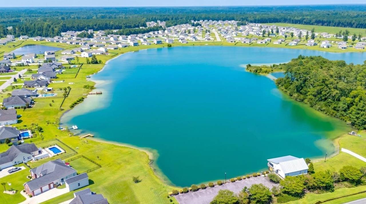 Community lake surrounded by homes and green space
