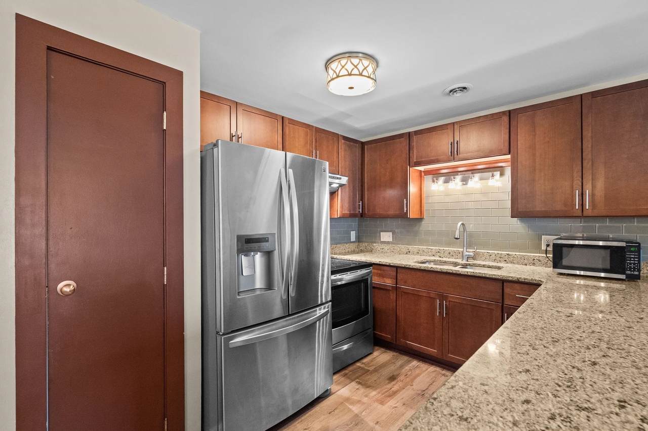 Kitchen with wood cabinetry and stainless-steel appliances