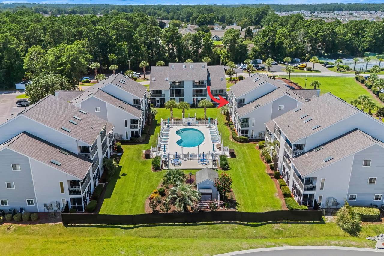 Aerial view of the Golf Colony buildings and outdoor pool