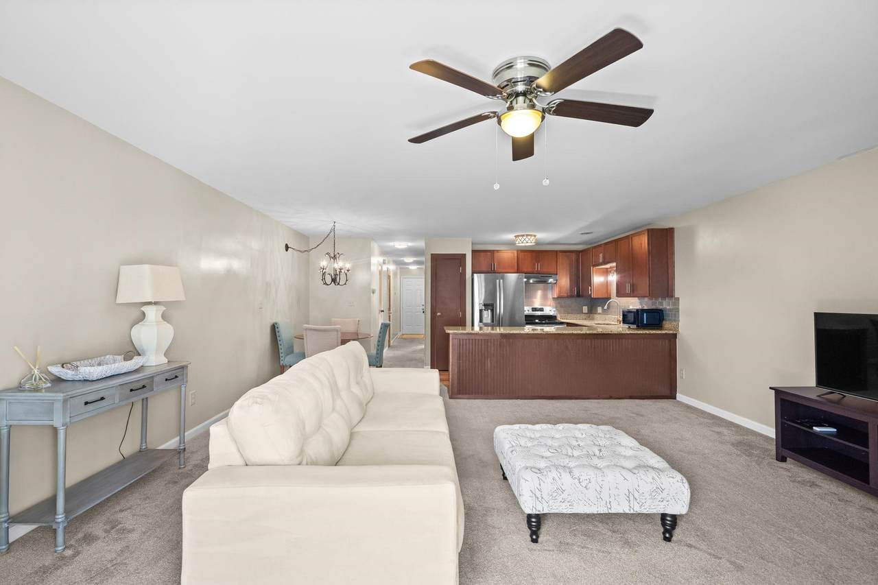 Furnished living room and open kitchen in Unit 27D