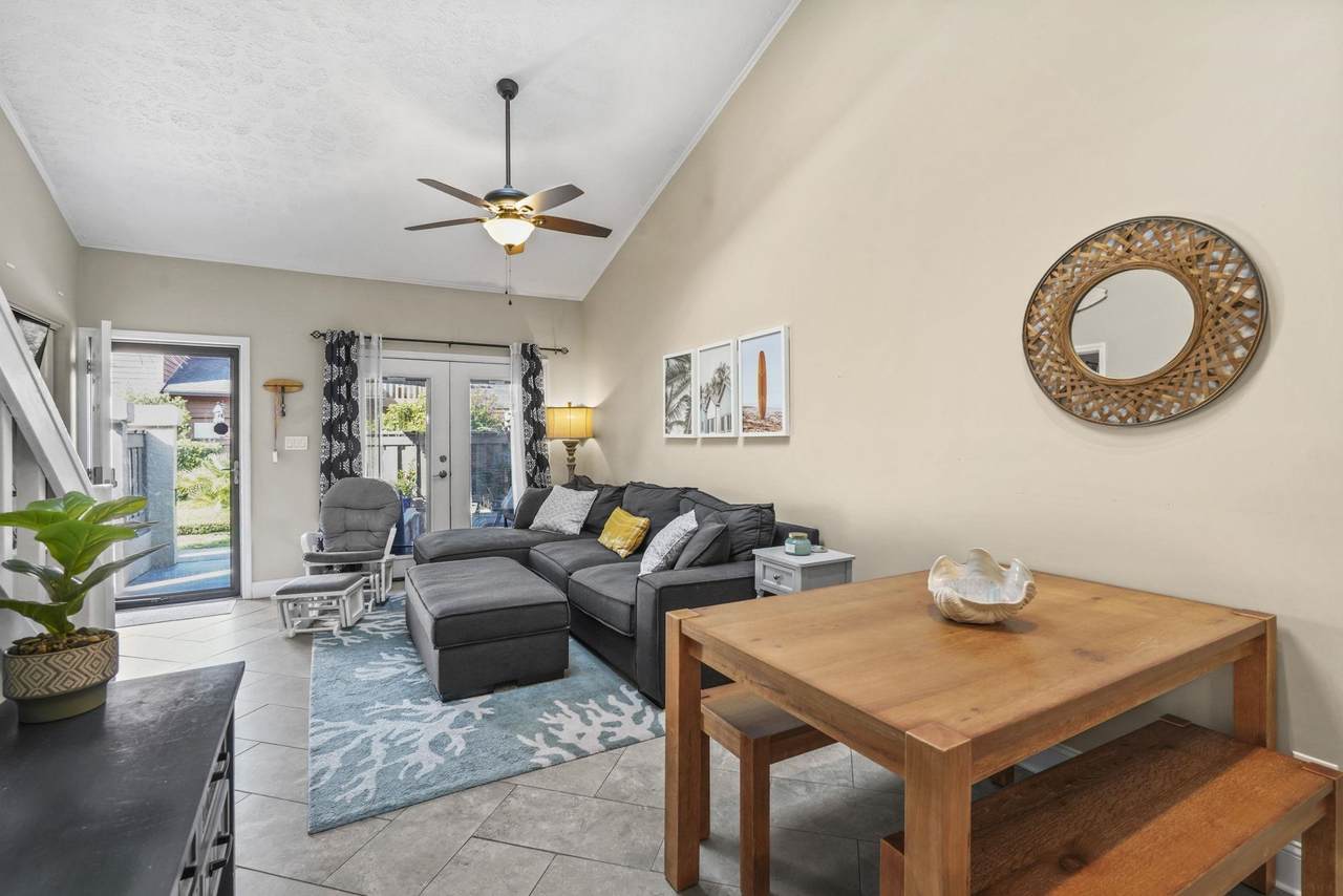 Vaulted living room and dining area inside Unit 30