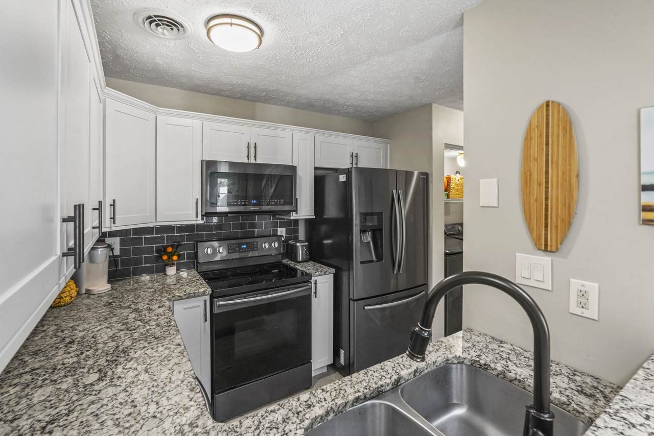 Kitchen with granite counters and stainless-steel appliances