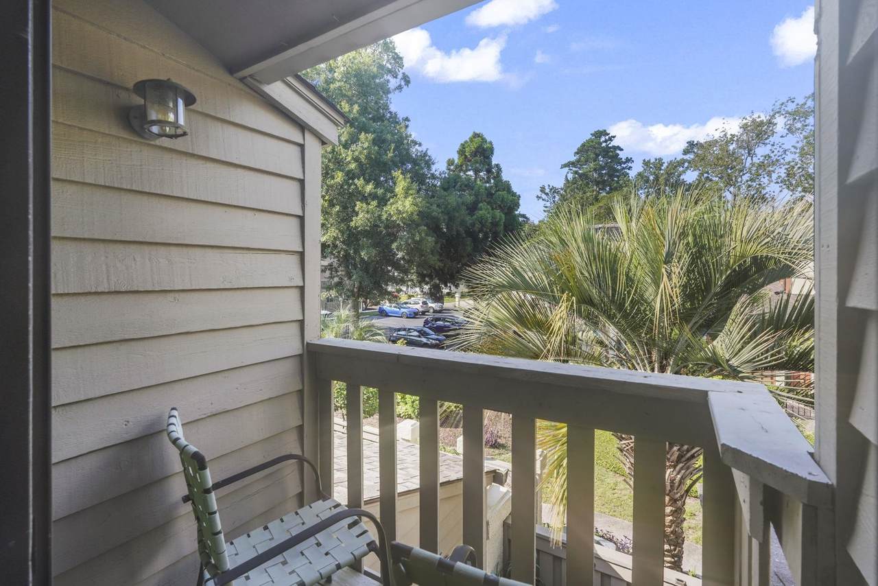 Upper balcony overlooking trees and the parking area