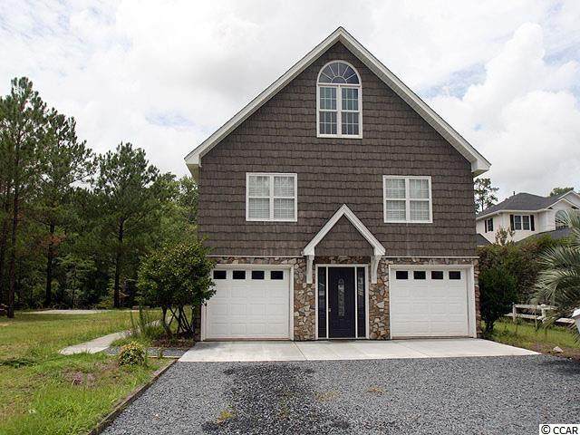 9858 Rivergate Dr. Nw - Photo 1