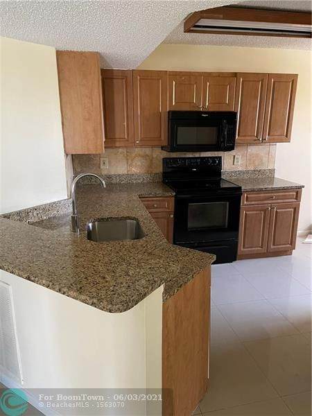 9055 Wiles Rd - Photo 1